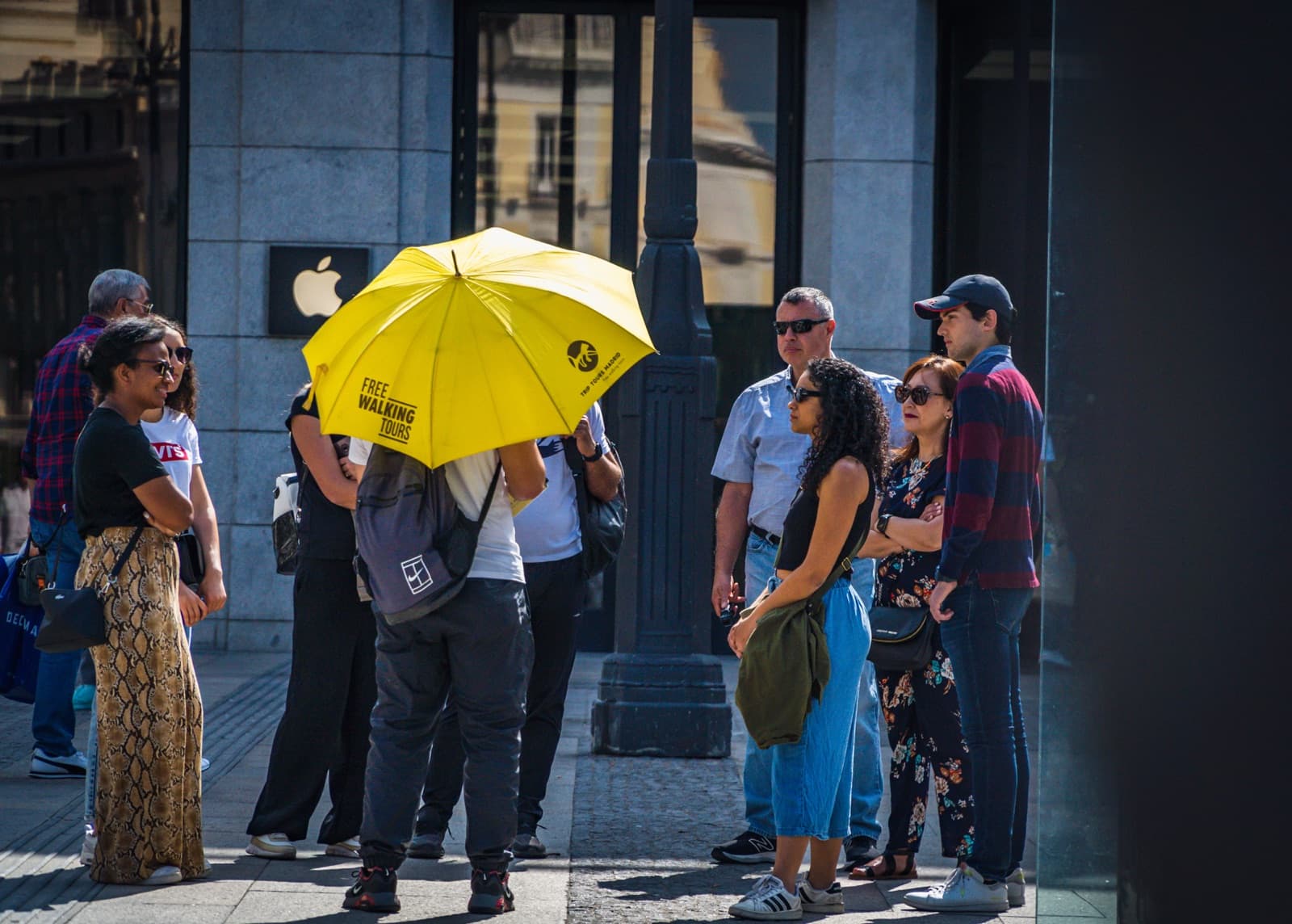 A Trip Tours free tour group under the yellow umbrella in Madrid